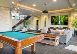 Modern finished basement renovation in Montreal with home theater