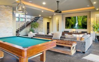 Modern finished basement renovation in Montreal with home theater